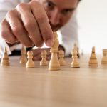 business-leader-arranging-chess-pieces-with-king-i-2021-08-28-10-40-38-utc (1)